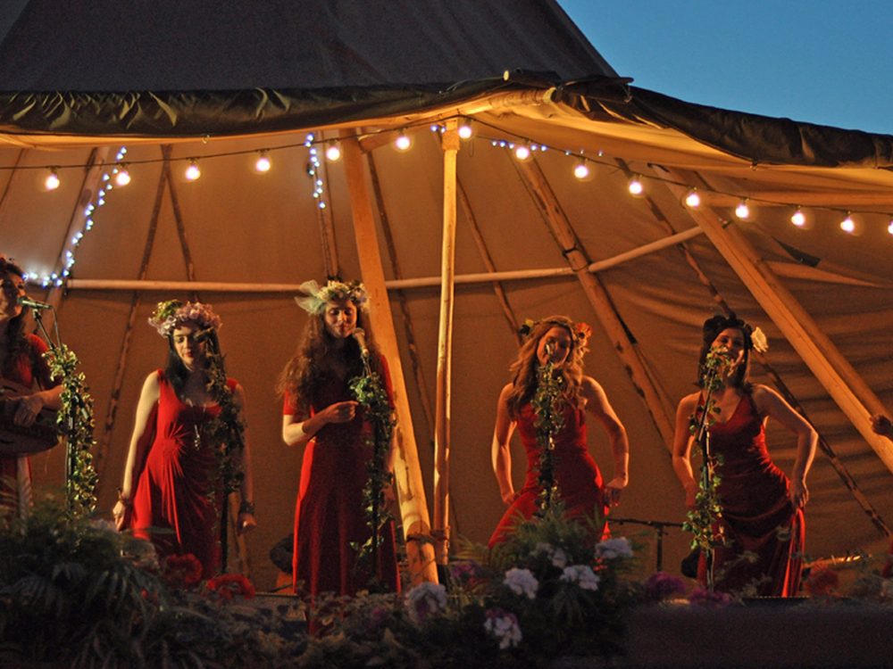A couple pointing at artwork inside a gift shop in west Norfolk.
