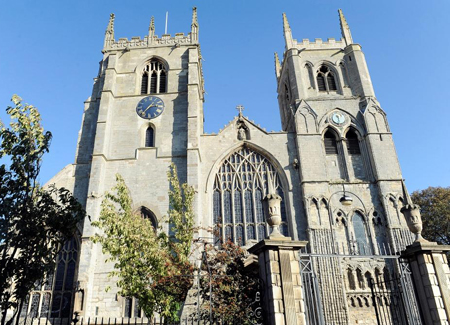 A daytime shot of King's Lynn Minster in the sunshine.