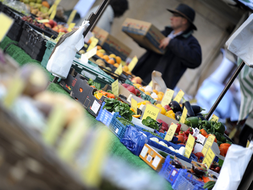 Fresh produce being sold at King's Lynn market including peppers, cabbage and aubergines.