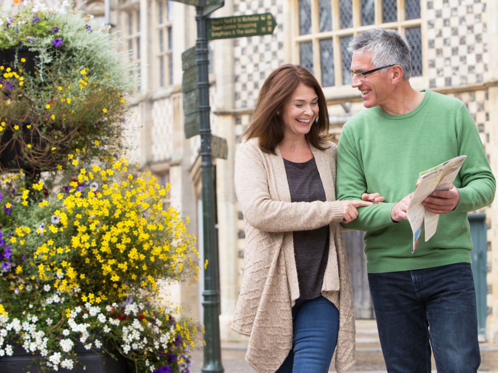 Hanse Day celebrations on Boal Quay in King's Lynn with a docked shit sitting in front of the Marriotts Warehouse. The King's Lynn Minster can be seen standing tall in the background.
