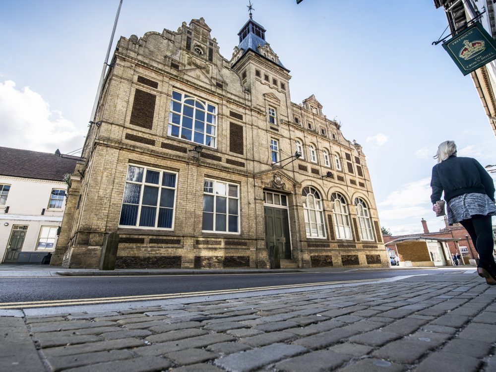 A shot of Downham Market's black and white town clock.