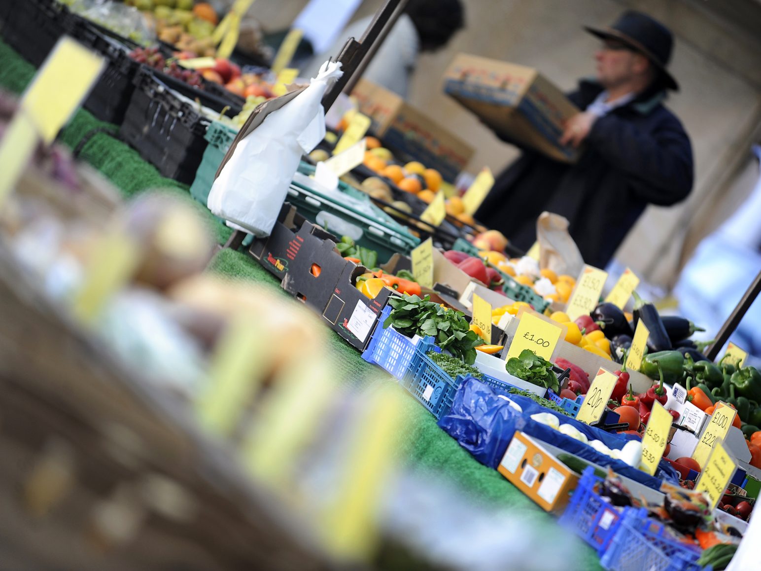 Fresh produce being sold at King's Lynn market including peppers, cabbage and aubergines.