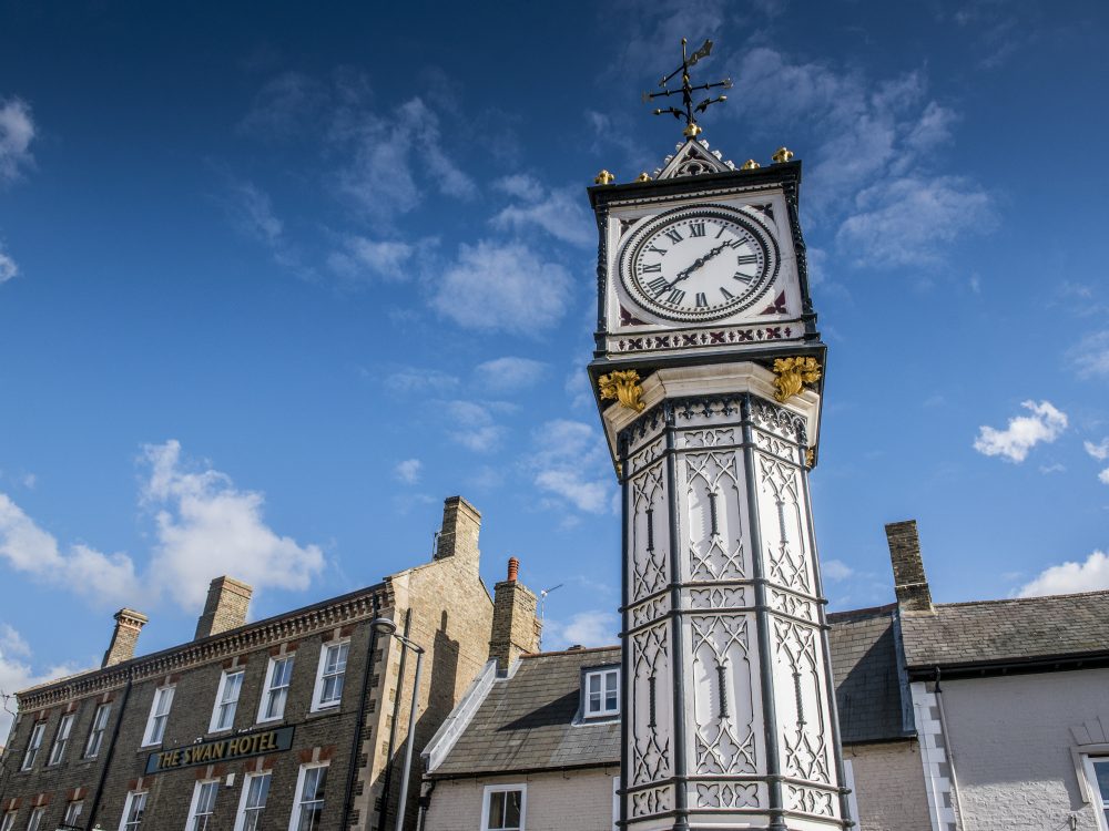 A shot of Downham Market's black and white town clock.