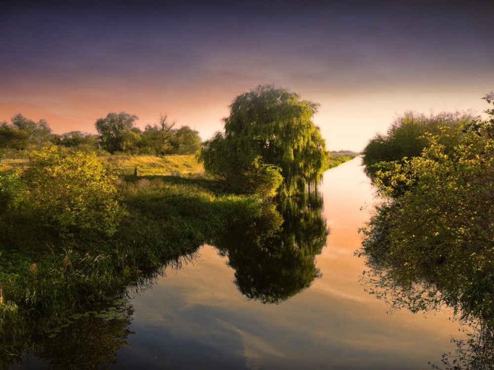 A sunset shot of the waves crashing on Old Hunstanton beach.