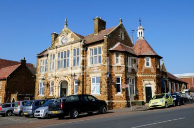 A shot of Downham Market's black and white town clock.