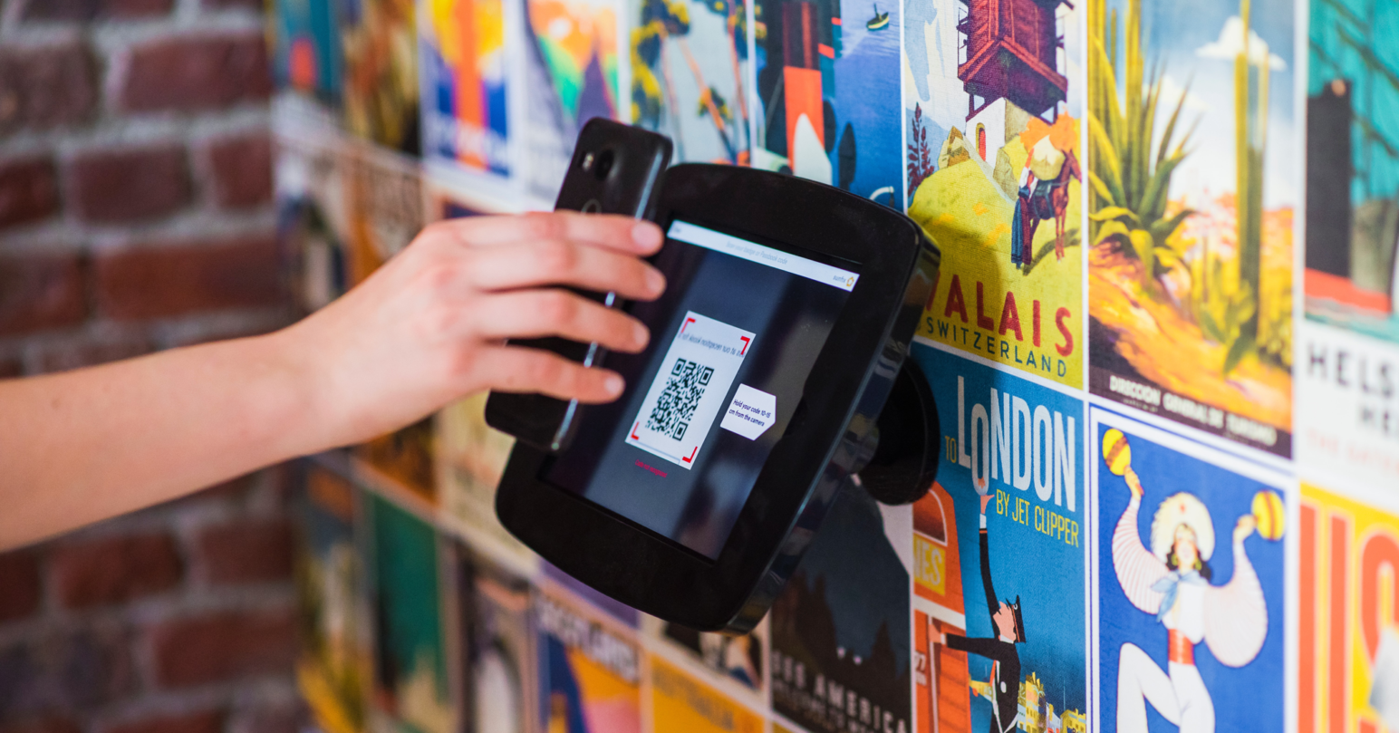 A person using a QR Code Scanner