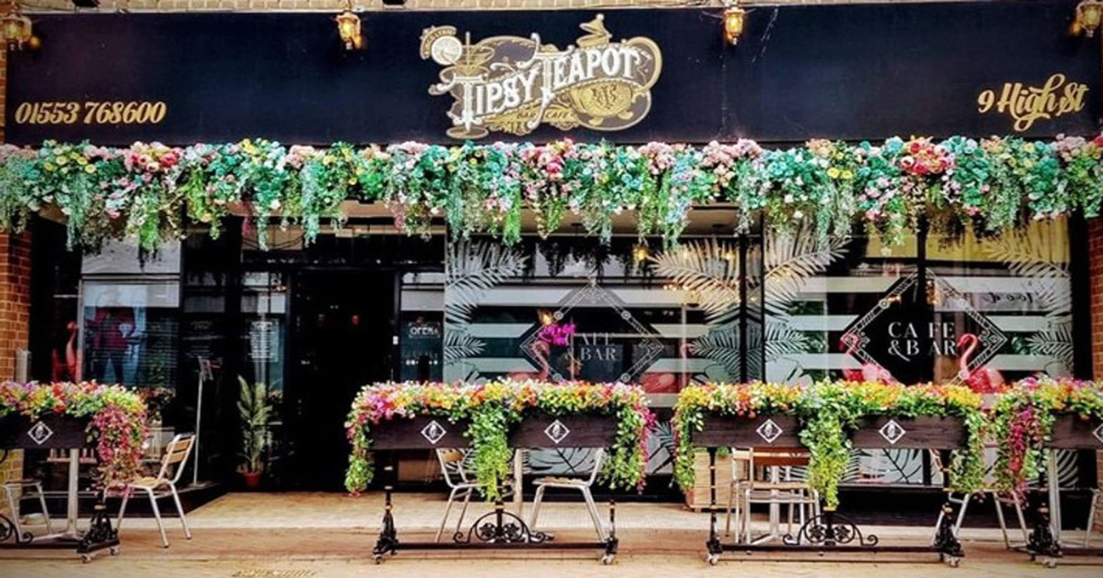 The colourful and floral exterior of Tipsy Teapot Bar and Restaurant in King's Lynn, West Norfolk.
