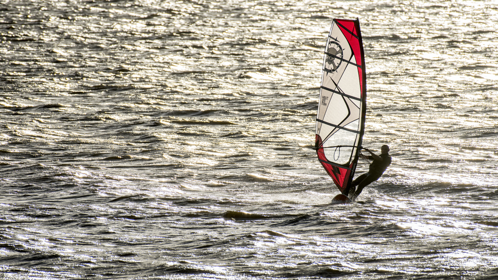 A man windsurfing in the Wash at Hunstanton