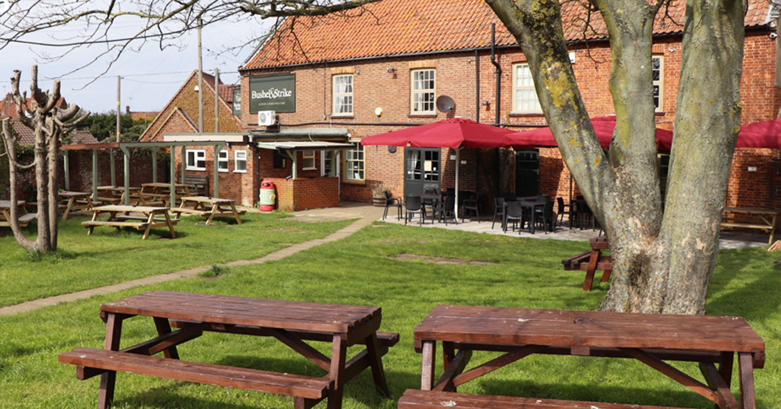 The exterior and outside seating area of Bushel and Strike in Heacham, West Norfolk.