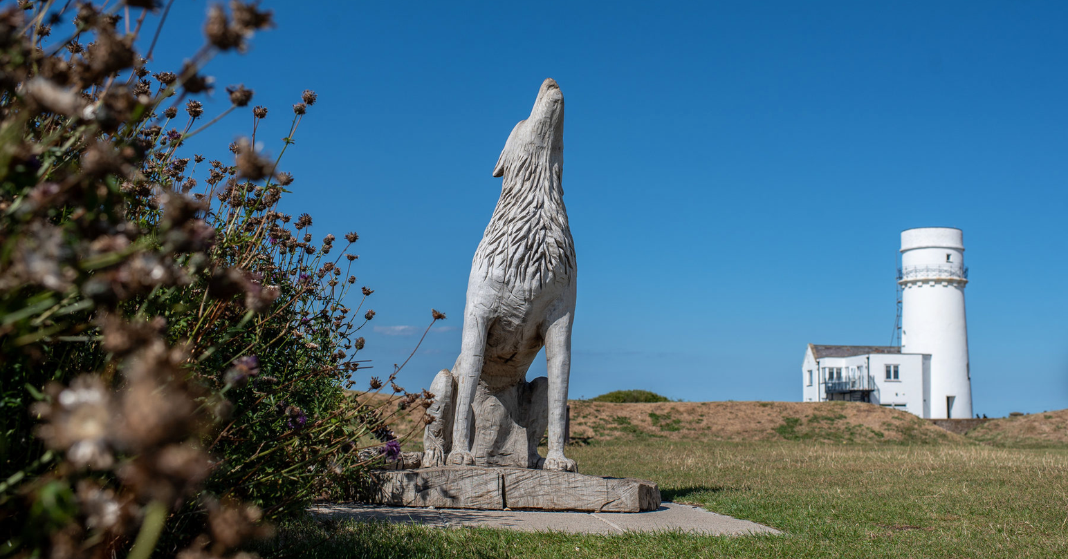 The wolf statue in front of Old Hunstanton Lighthouse in Hunstanton, West Norfolk.
