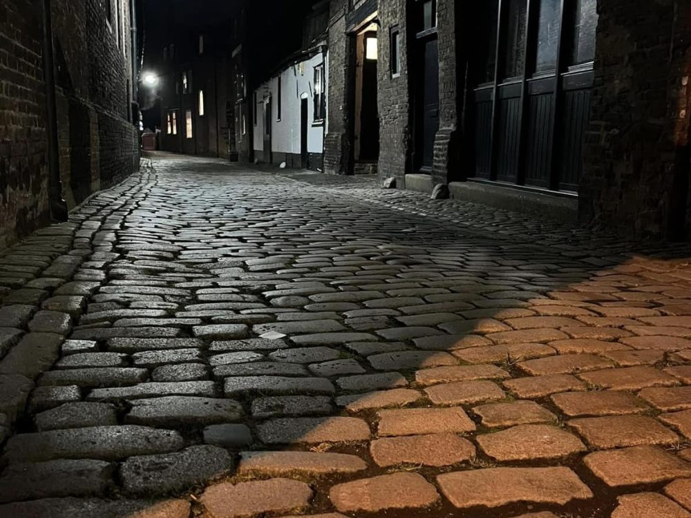 A child holding a large pumpkin at Oxburgh Estate, West Norfolk.