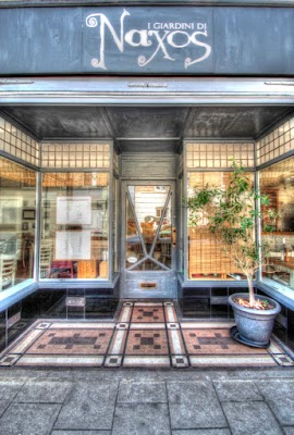A family of three holding hands and walking through Burnham Overy in West Norfolk.