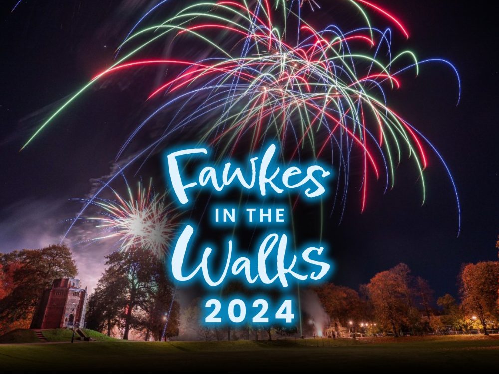 A child holding a large pumpkin at Oxburgh Estate, West Norfolk.